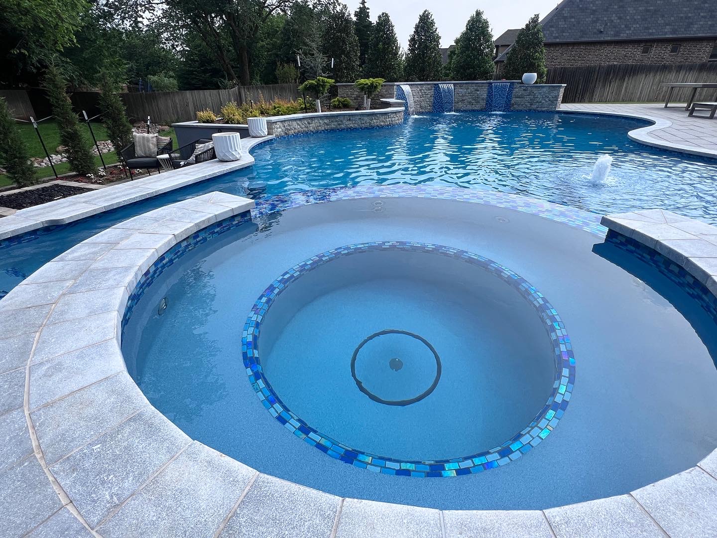 Spa interior with tile and coping detail by Mirage Pools & Spa in Twin Bridges Edmond OK.