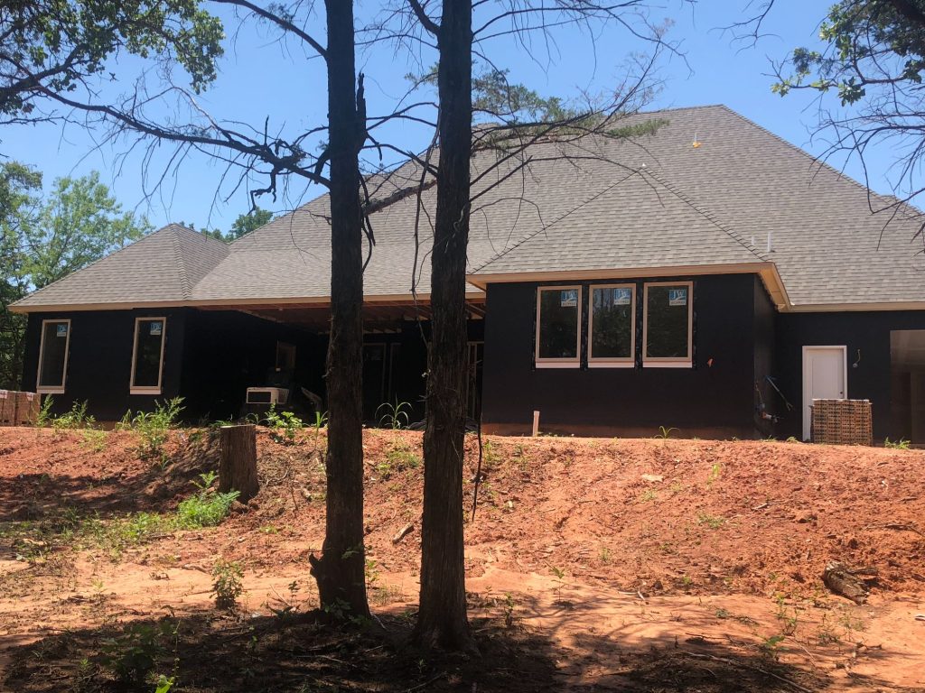 Backyard of home in The Falls Jones Oklahoma before freeform pool construction.
